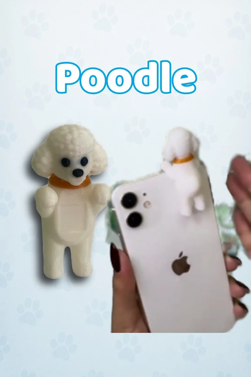 Accesorio 3D de Poodle mostrado de frente y colocado en un celular